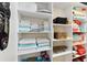 Well-organized linen closet with shelving, towels, and storage at 10129 Sw 77Th Loop, Ocala, FL 34481