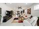 Open concept living area with tile floors, a ceiling fan, and a connected kitchen at 10129 Sw 77Th Loop, Ocala, FL 34481