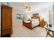 Main bedroom offers a serene setting with a ceiling fan and lots of natural light at 10129 Sw 77Th Loop, Ocala, FL 34481