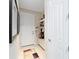Convenient mud room with storage bench and shelving at 10129 Sw 77Th Loop, Ocala, FL 34481