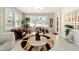 Sunlit sitting area with many windows with interior shutter offers bright views at 10129 Sw 77Th Loop, Ocala, FL 34481
