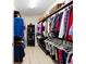 Spacious walk-in closet with shelving and hanging space for organization at 10129 Sw 77Th Loop, Ocala, FL 34481