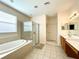 Spacious Primary bathroom with double sinks, garden tub, and separate shower at 1033 Sw 159Th St, Ocala, FL 34473