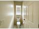 Small powder room with toilet and single sink at 1033 Sw 159Th St, Ocala, FL 34473