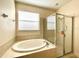 Bathroom with shower and tub combo at 1033 Sw 159Th St, Ocala, FL 34473