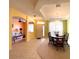 Bright dining room with a table and chairs, adjacent to the living room at 1033 Sw 159Th St, Ocala, FL 34473