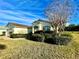 One-story house with a two-car garage and neatly landscaped yard at 1033 Sw 159Th St, Ocala, FL 34473