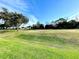 Expansive green golf course landscape under a vibrant blue sky at 1033 Sw 159Th St, Ocala, FL 34473