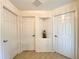 Bright hallway with three doors and wood-look flooring at 1033 Sw 159Th St, Ocala, FL 34473