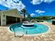 Relaxing circular hot tub surrounded by a brick patio at 1033 Sw 159Th St, Ocala, FL 34473
