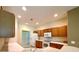 Galley kitchen with wood cabinets and white appliances at 1033 Sw 159Th St, Ocala, FL 34473