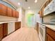 Modern kitchen with wood cabinets, white appliances, and a light and airy feel at 1033 Sw 159Th St, Ocala, FL 34473