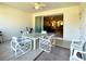 Covered patio with seating area and view of the living room at 1033 Sw 159Th St, Ocala, FL 34473