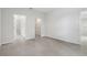 Open bedroom space with tiled floor, neutral walls, closet, and en-suite bathroom access at 13143 Sw 67Th Ave, Ocala, FL 34473