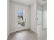 Bright entryway with tiled floors, a modern front door with glass panels, and neutral-colored walls at 13143 Sw 67Th Ave, Ocala, FL 34473