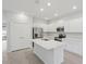 Stylish kitchen with white cabinets, stainless steel appliances, quartz counters, and large center island at 13143 Sw 67Th Ave, Ocala, FL 34473