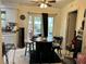 Bright dining area with patio access and casual seating, perfect for everyday meals at 14118 Se 45Th Ct, Summerfield, FL 34491