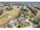 Aerial view of home with pool and golf course views at 17999 Se 99Th Ave, Summerfield, FL 34491