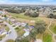 Wide aerial view showing house and surrounding neighborhood at 17999 Se 99Th Ave, Summerfield, FL 34491