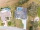 Aerial view showing home, pool, and surrounding landscape at 17999 Se 99Th Ave, Summerfield, FL 34491