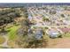 Aerial view highlighting home's pool and golf course view at 17999 Se 99Th Ave, Summerfield, FL 34491
