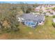 Aerial view showcasing home's pool and backyard at 17999 Se 99Th Ave, Summerfield, FL 34491