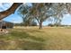 Spacious backyard with golf course views and screened patio at 17999 Se 99Th Ave, Summerfield, FL 34491