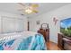 Bedroom with a queen-size bed and hardwood floors at 17999 Se 99Th Ave, Summerfield, FL 34491