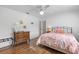 Bedroom with a queen-size bed and hardwood floors at 17999 Se 99Th Ave, Summerfield, FL 34491