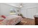 Bedroom with a queen-size bed and hardwood floors at 17999 Se 99Th Ave, Summerfield, FL 34491