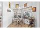 Cozy breakfast nook with a small table and wine rack at 17999 Se 99Th Ave, Summerfield, FL 34491