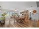 Bright dining room with wood floors and large windows at 17999 Se 99Th Ave, Summerfield, FL 34491