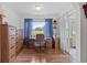 Bright home office features built-in desk, hardwood floors, and serene views at 17999 Se 99Th Ave, Summerfield, FL 34491