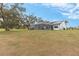 House exterior with solar panels and golf course view at 17999 Se 99Th Ave, Summerfield, FL 34491
