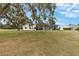Back of house with screened patio and golf course views at 17999 Se 99Th Ave, Summerfield, FL 34491