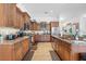Modern kitchen with granite countertops and stainless steel appliances at 17999 Se 99Th Ave, Summerfield, FL 34491