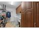 Laundry room with washer, dryer, and ample cabinet storage at 17999 Se 99Th Ave, Summerfield, FL 34491