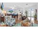 Open concept living area with pool table and hardwood floors at 17999 Se 99Th Ave, Summerfield, FL 34491