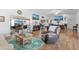 Relaxing living area with hardwood floors and comfy seating at 17999 Se 99Th Ave, Summerfield, FL 34491