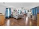 Main bedroom with a large bed and access to a sitting area at 17999 Se 99Th Ave, Summerfield, FL 34491