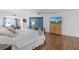 Main bedroom with a king-size bed, dresser, and TV at 17999 Se 99Th Ave, Summerfield, FL 34491