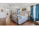 Spacious main bedroom with king-size bed and ensuite bathroom at 17999 Se 99Th Ave, Summerfield, FL 34491