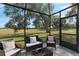 Relaxing patio with seating area and golf course view at 17999 Se 99Th Ave, Summerfield, FL 34491