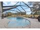 Relaxing pool and spa with screened enclosure, overlooking a golf course at 17999 Se 99Th Ave, Summerfield, FL 34491