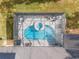 An aerial view of a beautiful, screened pool and spa at 17999 Se 99Th Ave, Summerfield, FL 34491