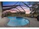 Relaxing screened pool and spa area with sunset views at 17999 Se 99Th Ave, Summerfield, FL 34491