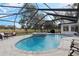 Resort-style pool and spa with screened enclosure, great for entertaining at 17999 Se 99Th Ave, Summerfield, FL 34491