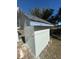 Small storage shed with painted block exterior and gray roof at 1890 Sw Shorewood Dr, Dunnellon, FL 34431