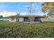 House back yard with screened porch and storage shed at 20 Pine Trace Run, Ocala, FL 34472