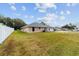 Expansive backyard with a well-maintained lawn and privacy fence, perfect for outdoor activities at 2105 Sw 4Th St, Ocala, FL 34471